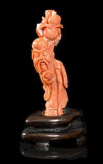 A Chinese Carved Coral Figure of Shoulao, Height 3 1/2 inches.