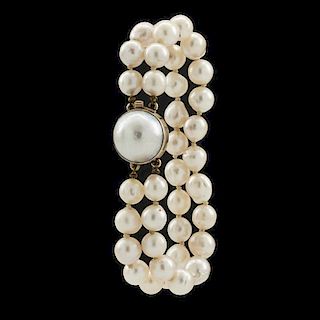 14k Yellow gold, double strand pearl bracelet with mabe pearl clasp.