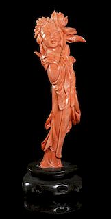 A Chinese Carved Coral Figure, Height 6 inches.