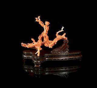 A Carved Coral Figural Composition, Width 8 1/8 inches.