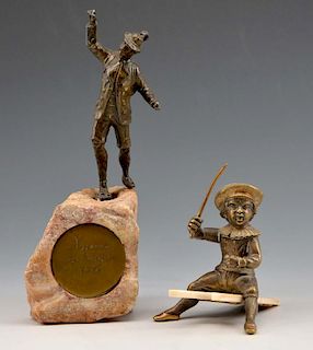 Grouping of two bronzes, mountain climber and boy