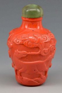 Chinese coral snuff bottle with carved horse
