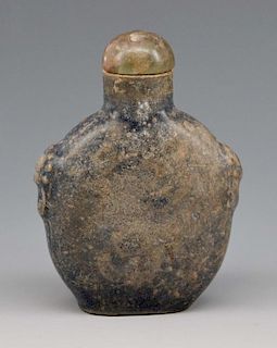 Early Chinese snuff bottle with carved shoulders