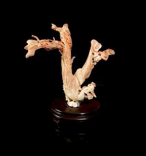 A Chinese Carved Coral Model of a Phoenix, Height 8 1/8 inches.