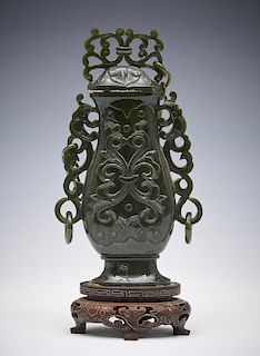 Chinese carved green jade urn on stand, 7"