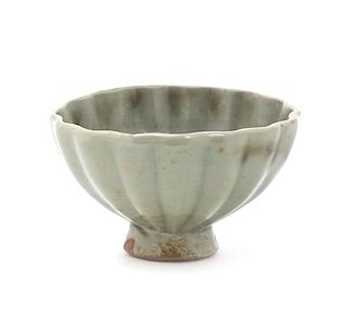 A Longquan Celadon Glaze Petal Carved Cup, Diameter 3 1/4 inches.