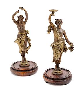 * A Pair of Continental Bronze Figural Candlesticks Height 7 inches.