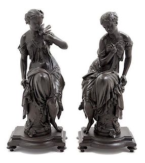 * A Pair of French Cast Metal Figures Height 19 inches.