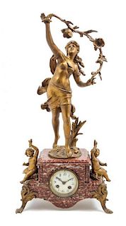 * A Gilt Metal and Marble Figural Mantel Clock Height 23 3/4 inches.