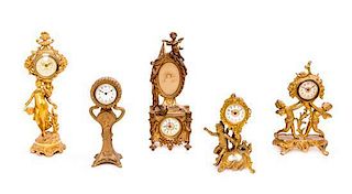 * Five French Gilt Metal Table Clocks Height of tallest 12 1/2 inches.