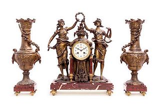 * A French Cast Metal and Marble Clock Garniture Height of clock 19 1/2 inches.