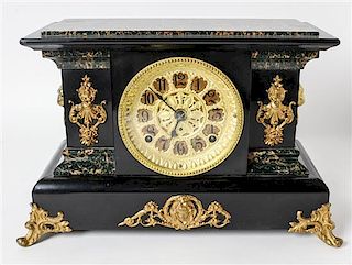A Victorian Mantel Clock Width 16 inches.