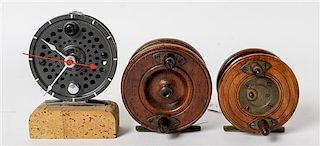 Two Mahogany Fishing Reels Diameter of largest 3 1/2 inches.