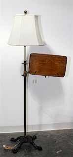 A Brass and Cast Metal Floor Lamp Height overall 61 inches.