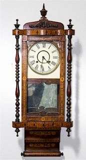 An American Parquetry Decorated Wall Clock Height 38 1/2 inches.