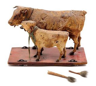 * A German Leather-Clad "Cow and Calf" Pull Toy Height 6 1/2 inches.