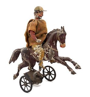 * A German Painted Tin "Horse and Rider" Toy Height 6 1/2 inches overall