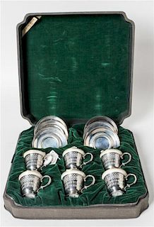 Six American Silver Demitasse Cups and Saucers, Webster Co., North Attleboro, MA, with gilt decorated porcelain liners.