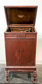 A Victor Floor Model Victrola, retailed by Grinnell Brothers, Grand Rapids, Michigan Height 38 1/2 x width 20 1/2 x depth 17 