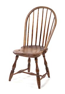 An Oak Windsor Chair Height 36 3/4 inches.