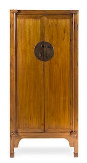 * A Chinese Hardwood Armoire Height 72 3/4 x width 34 x depth 21 1/4 inches.