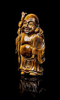 * A Carved Tiger's Eye Figure of Buddha Height 7 inches.