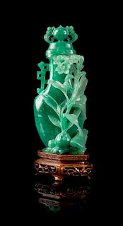 * A Jadeite Covered Vase Height 6 inches.