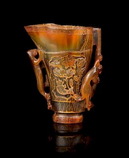 * A Carved Buffalo Horn Libation Cup Height 4 1/4 inches.