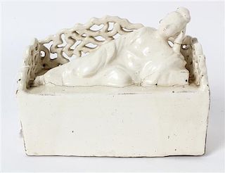 * A White Glazed Figure of a Meiren Length 7 1/2 inches.
