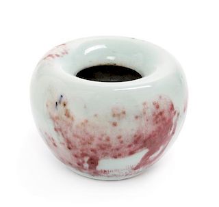 A Peachbloom Glazed Porcelain Water Dropper Height 2 5/8 x diameter 3 1/2 inches.