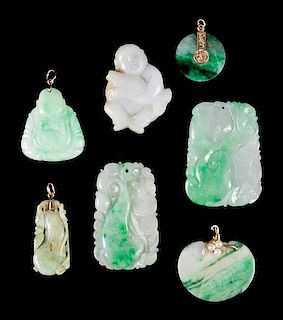 Seven Jadeite Pendants Height of largest 2 x width 1 3/8 inches.