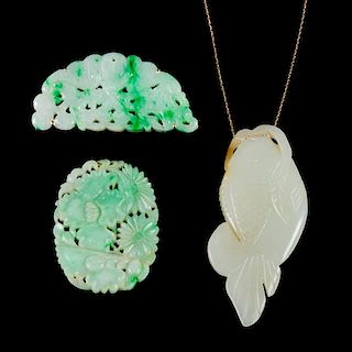 Three Carved Jade and Jadeite Pendants Length of largest 2 1/2 inches.