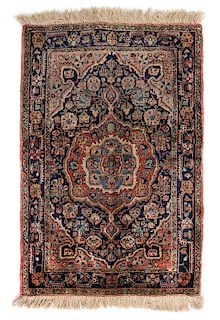 A Sarouk Wool Rug 2 feet 9 1/2 inches x 1 foot 11 3/4 inches.
