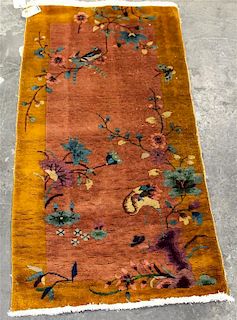 * A Chinese Wool Rug 4 feet 8 inches x 2 feet 5 inches.