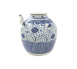 A Chinese Blue and White Wine Pot and Cover, Height 10 1/2 inches.