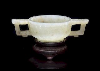 A Carved Jade Bowl, Width over handles 4 1/2 inches.