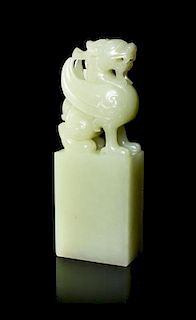 A Carved Celadon Jade Seal Stamp, Height 4 5/8 inches.