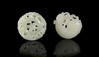 Two Circular Carved Jade Plaques, Width of larger 2 1/4 inches.