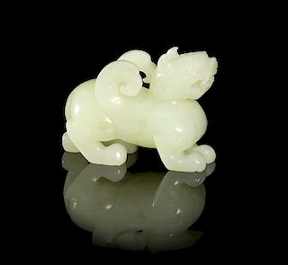A Carved Jade Figure of a Winged Chimera, Width 2 1/8 inches.