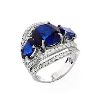 Approx. 10.30 Carat Oval Cut Synthetic Sapphire, 1.20 Carat Round Brilliant Cut Diamond and 18 Karat White Gold Ring