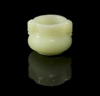 A Carved Pale Celadon Jade Diminutive Pot, Height 1 5/8 inches.