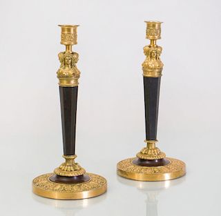 PAIR OF EMPIRE STYLE GILT AND PATINATED BRONZE CANDLESTICKS