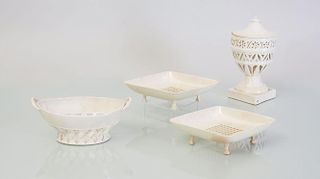 PAIR OF CREAMWARE DIAMOND-SHAPED, FOOTED STRAINERS, A SEWELL FRUIT BOWL, AND A RETICULATED URN AND ASSOCIATED COVER