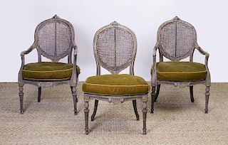 PAIR OF LOUIS XVI STYLE PAINTED AND CANED FAUTEUILS EN CABRIOLET AND A MATCHING CHAISE