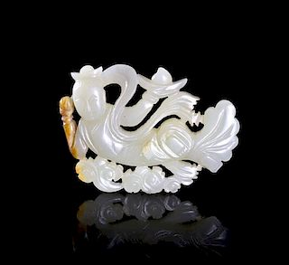A White Jade Carved Toggle of a Flying Apsara, Width 2 1/8 inches.