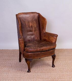 GEORGE III STYLE MAHOGANY AND LEATHER UPHOLSTERED WING CHAIR