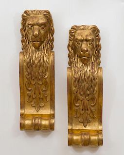 PAIR OF CONTINENTAL GILTWOOD LION-FORM WALL APPLIQUES