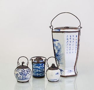 GROUP OF FOUR CHINESE METAL-MOUNTED BLUE AND WHITE PORCELAIN OPIUM POTS WITH PIPE STEMS