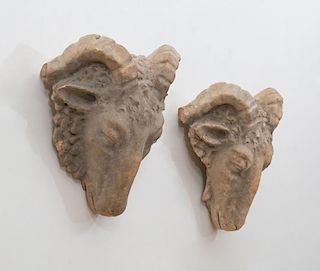 PAIR OF FRENCH TERRACOTTA RAMS-HEAD ORNAMENTS
