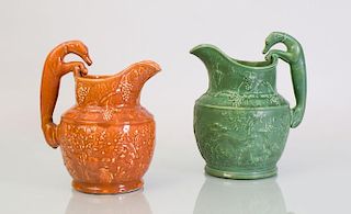TWO GLAZED POTTERY JUGS WITH HOUND-FORM HANDLES